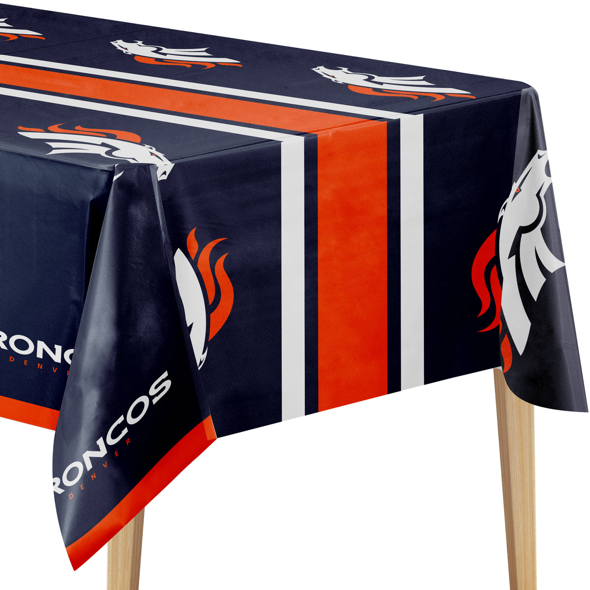 Close-up image of Denver Broncos tablecloth with navy background, orange and white Broncos logo, and "DENVER BRONCOS" text on a wooden table.
