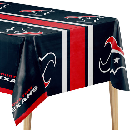 Houston Texans themed tablecloth on a table, featuring the team's navy blue, red, and white logo pattern and 'HOUSTON TEXANS' text.