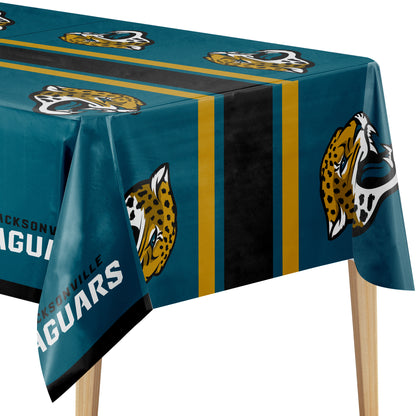 A Jacksonville Jaguars themed tablecloth draped over a table, featuring the team's teal background, black and gold stripes, and the jaguar logo.