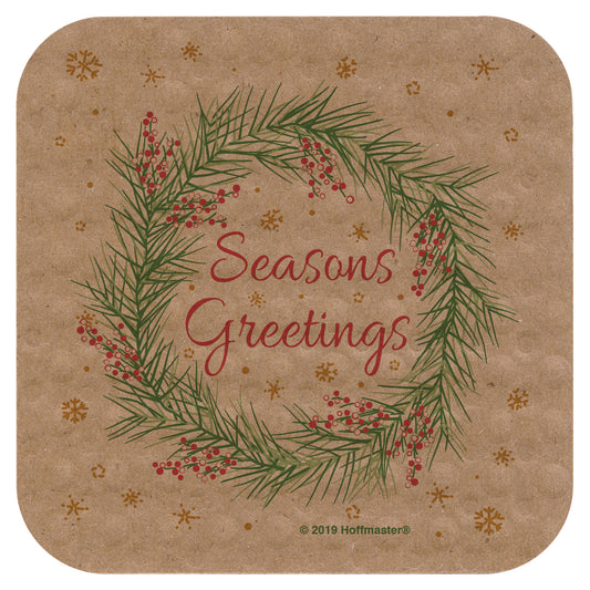Coaster with Christmas wreath design and 'Seasons Greetings' text on a brown kraft-colored background.