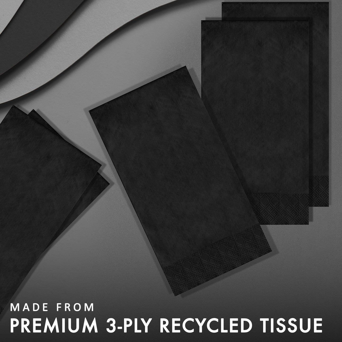 Black pin embossed guest napkins on a grey background with "Made from premium 3-ply recycled tissue"