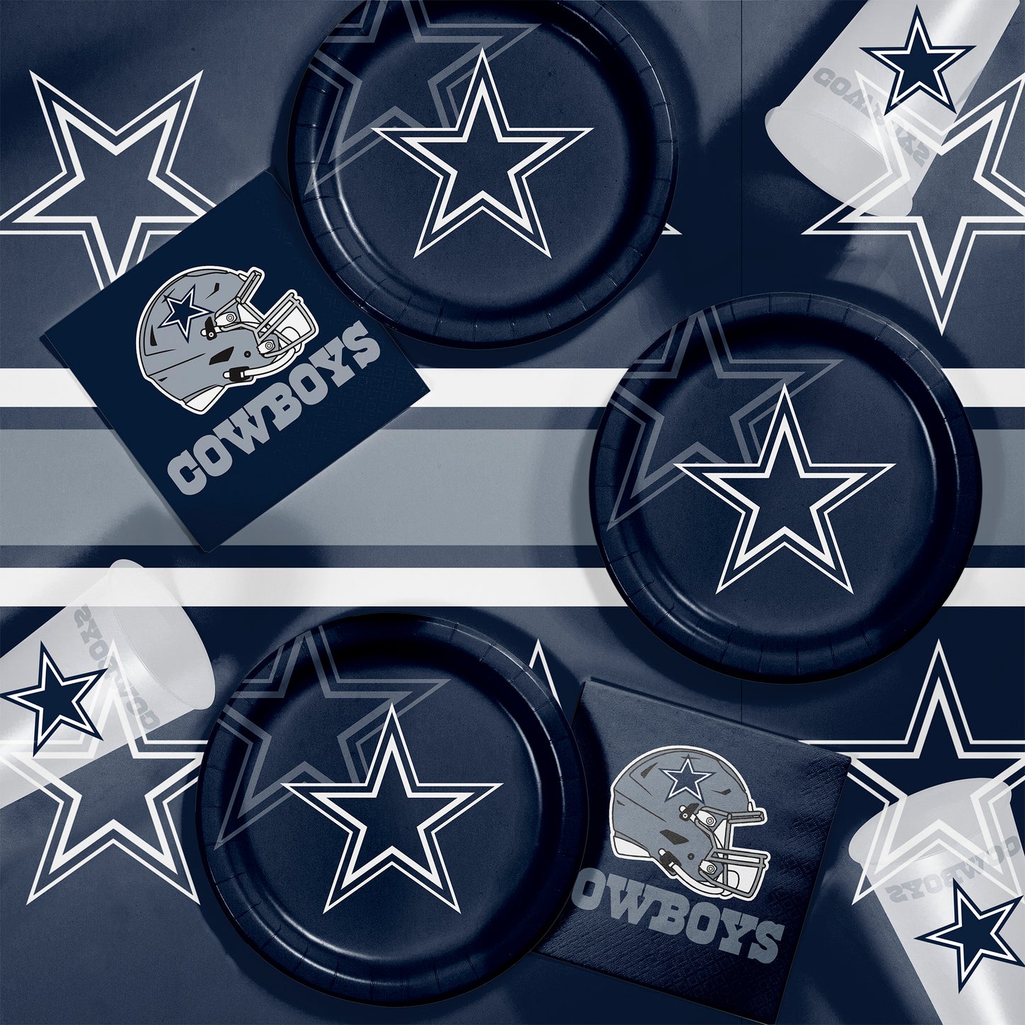 Dallas Cowboys plates, napkins and cups displayed on a matching tablecloth