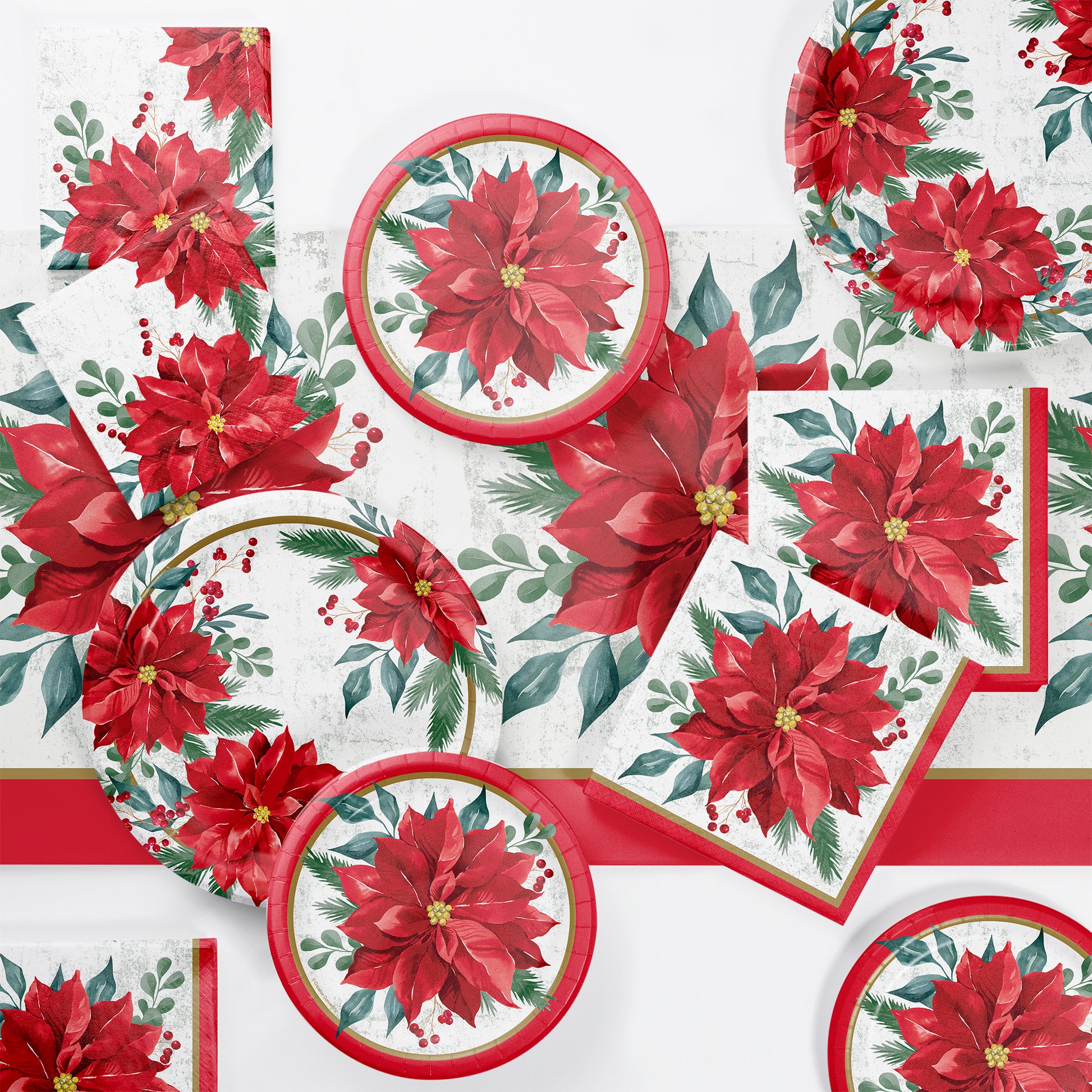 Christmas-themed tableware set with red poinsettia flowers on a white background