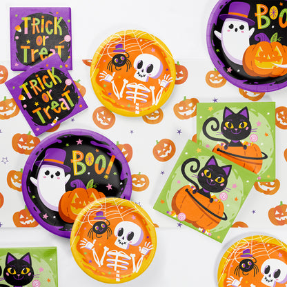 Glowing Ghouls Dessert Paper Plates 96 ct. Halloween-themed paper plates and napkins with ghost, skeleton, and cat designs on a white background.