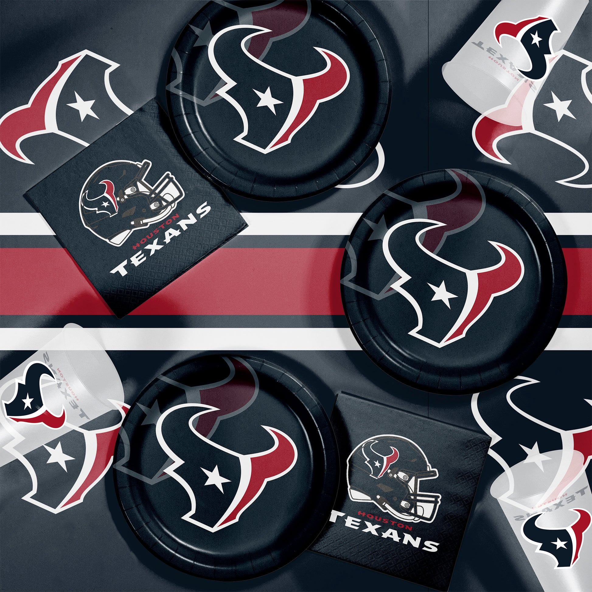 Houston Texans plates, napkins and cups displayed on a matching tablecloth