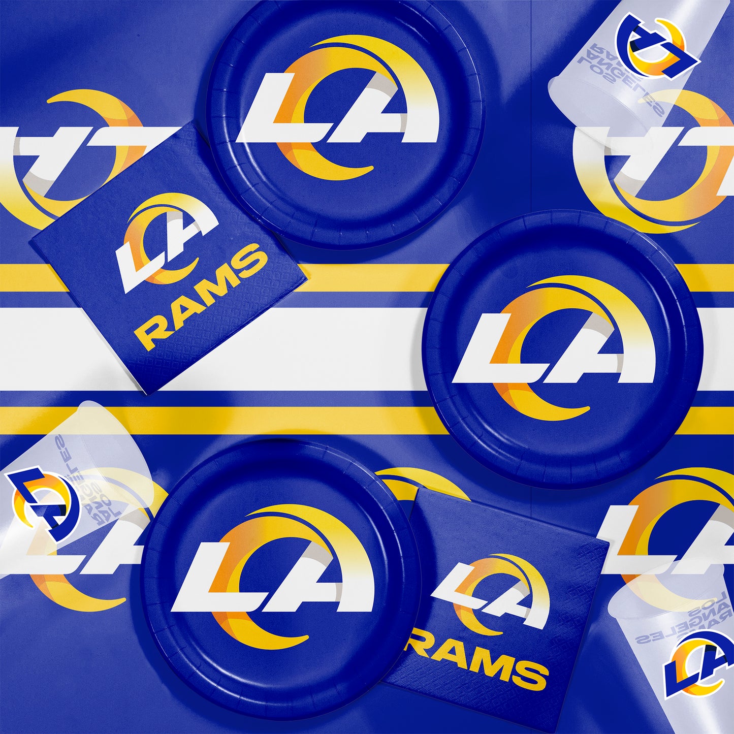 LA Rams-themed party supplies including plates, napkins, and cups on a blue background.