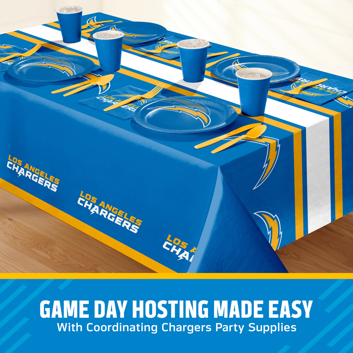 Los Angeles Chargers themed party table setting with a printed tablecloth, matching plates, cups, and utensils, shown on a table with a promotional banner at the bottom that says "Game Day Hosting Made Easy".