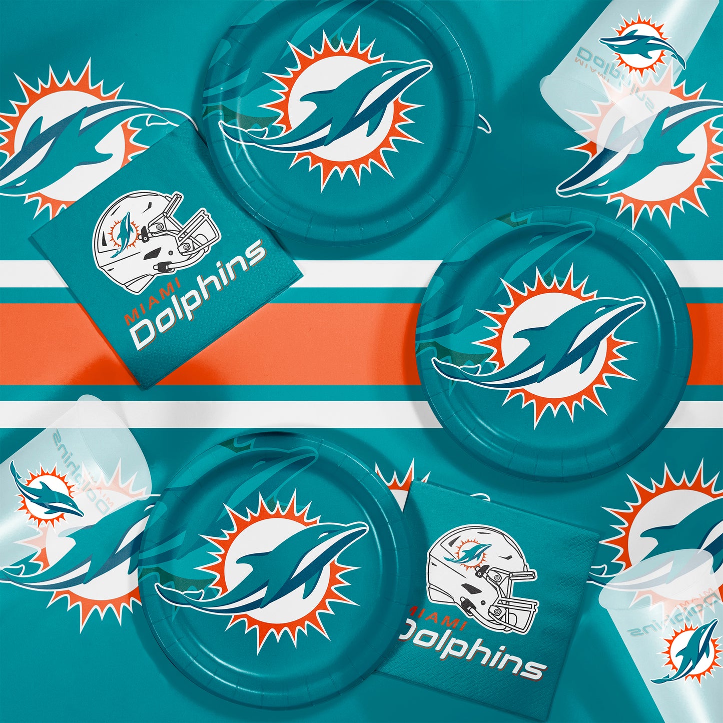 Miami Dolphins plates, napkins and cups displayed on a matching tablecloth