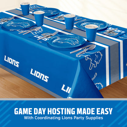 Detroit Lions themed party table setting with a printed tablecloth, matching plates, cups, and utensils, shown on a table with a promotional banner at the bottom that says "Game Day Hosting Made Easy".