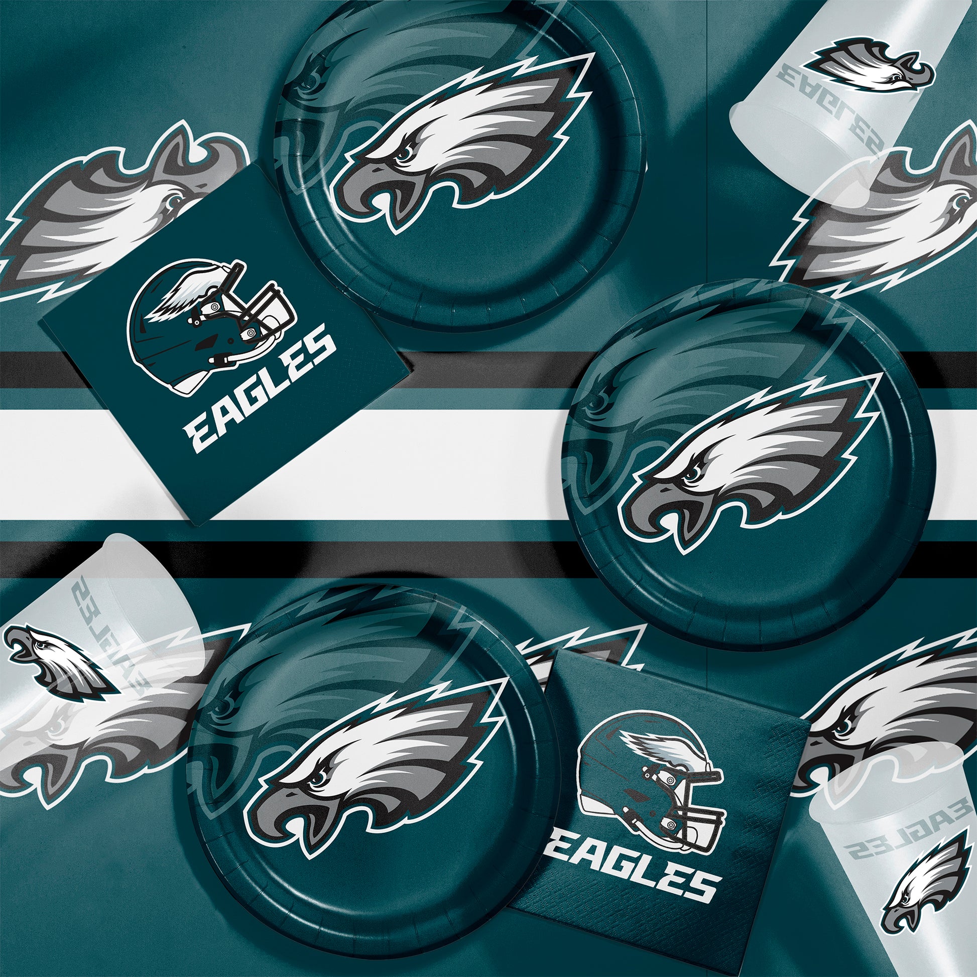 Philadelphia Eagles plates, napkins and cups displayed on a matching tablecloth