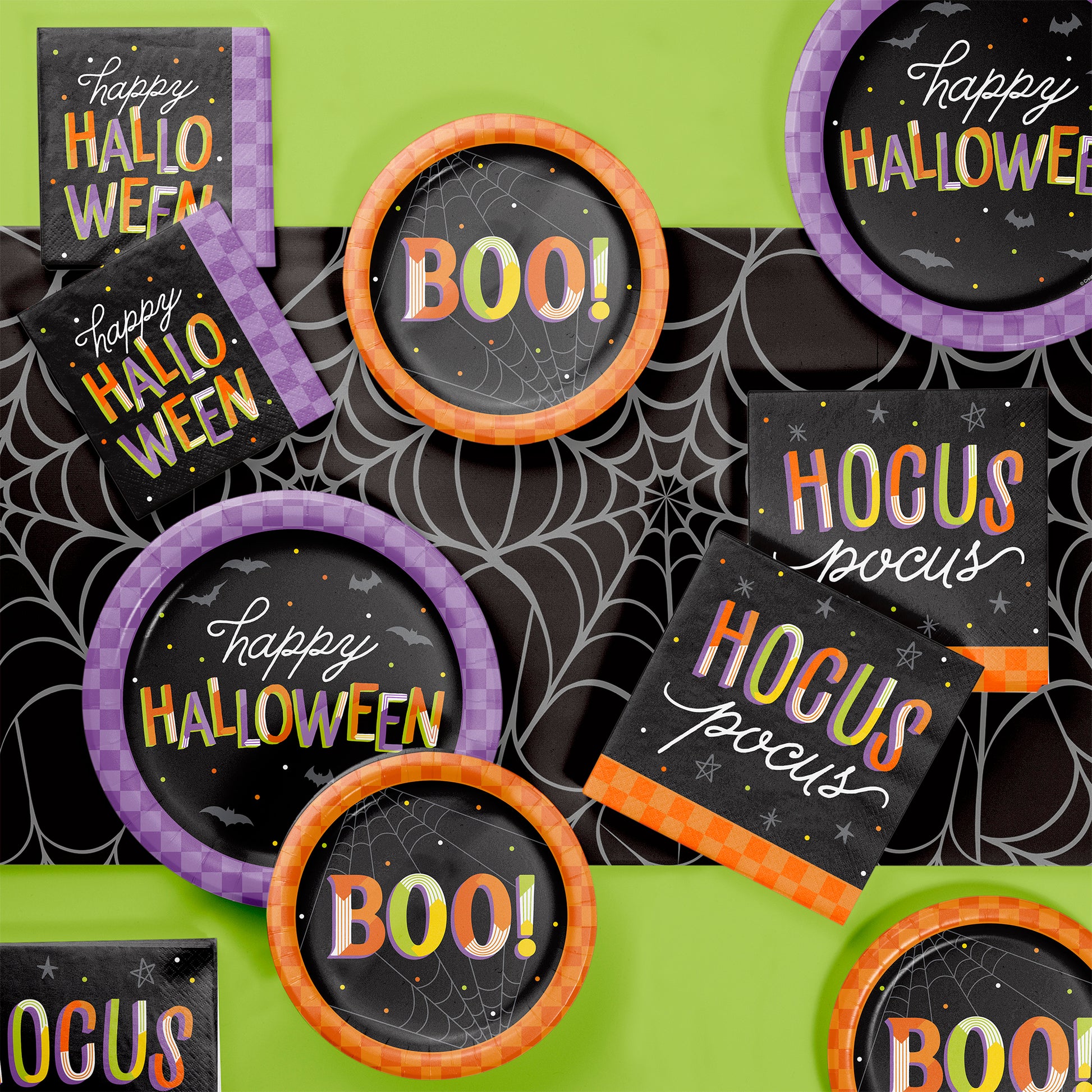 Retro Happy Halloween Dinner Paper Plates 96 ct. Halloween-themed decorations with 'Happy Halloween' and 'BOO!' text on a green background.