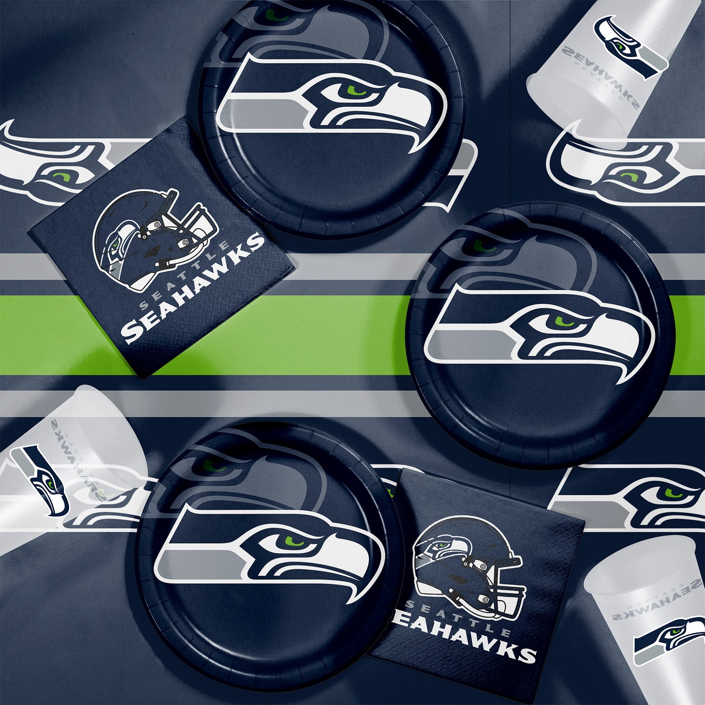 Collection of Seattle Seahawks-themed party supplies including plates, cups, and napkins on a dark background.