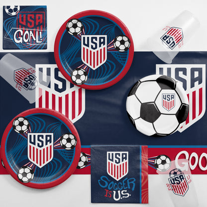 USA Men's Soccer Team soccer-themed party supplies including plates, cups, and napkins on a matching tablecloth