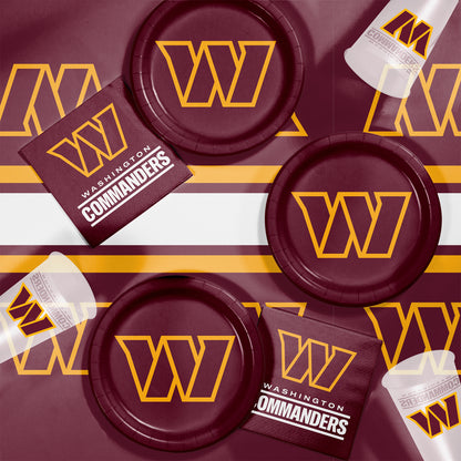 Washington Commanders plates, napkins and cups displayed on a matching tablecloth